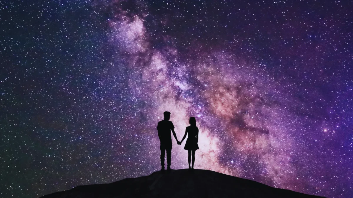 couple standing outside under starry sky