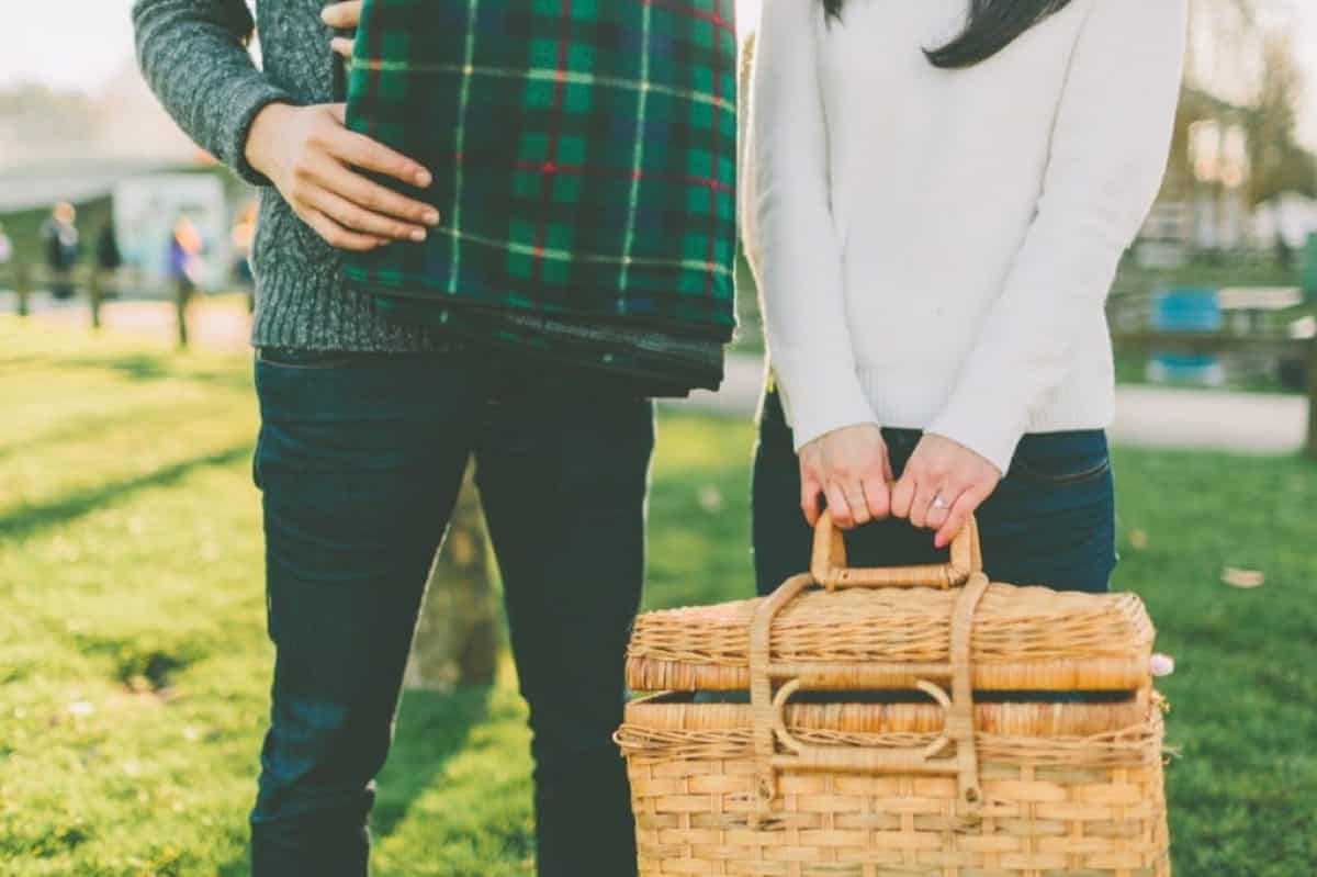 couple holding picnic basket