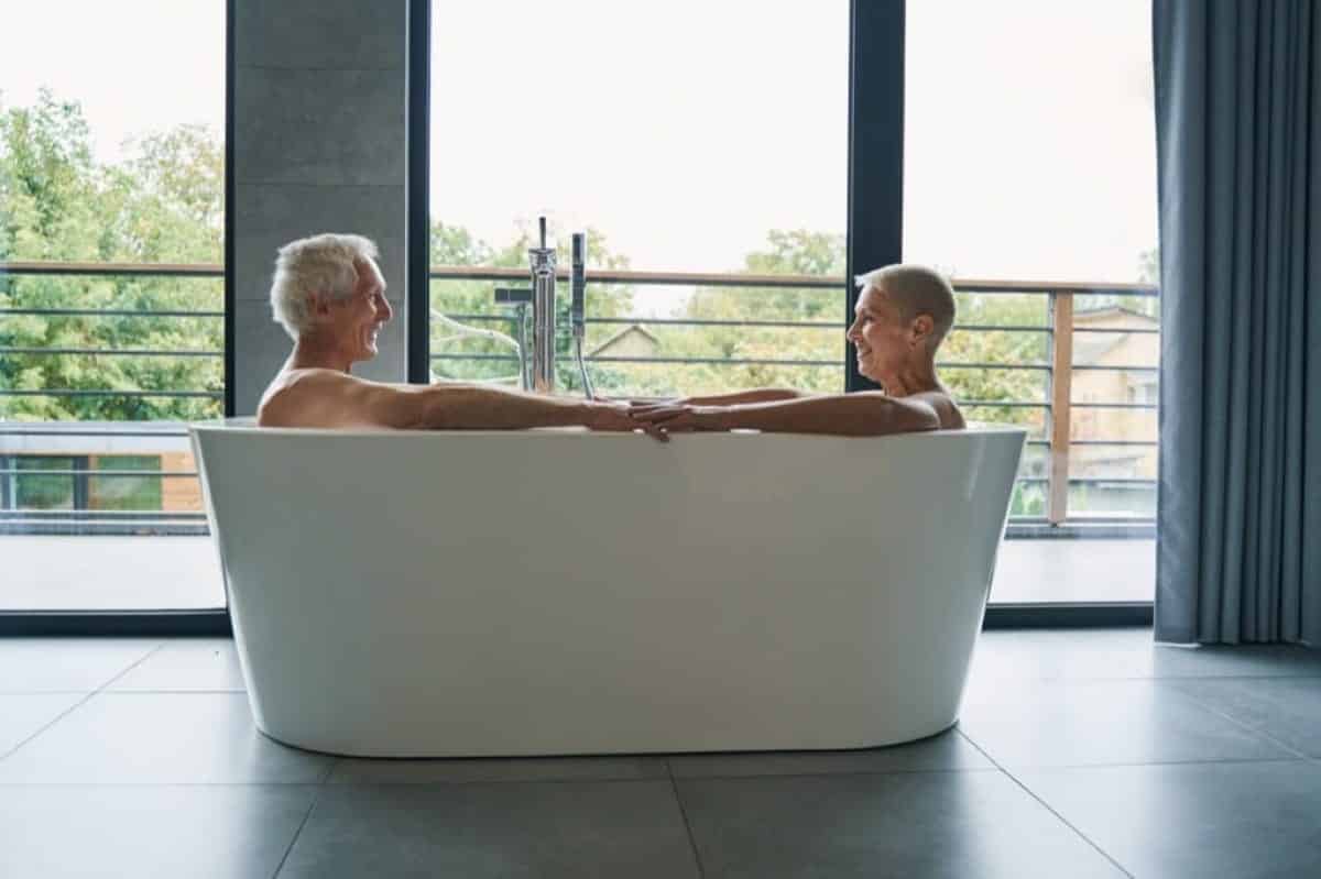Couple sitting in bathtub together