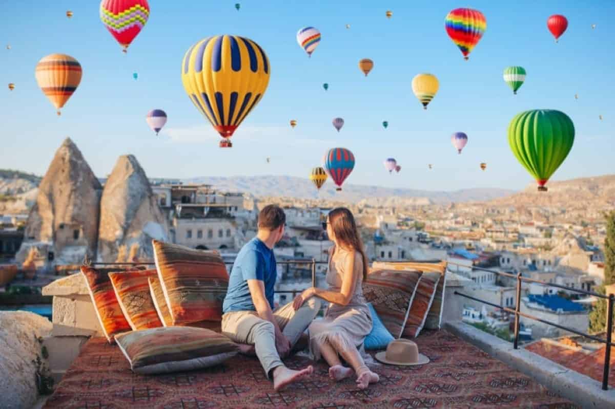 couple watching hot air balloons