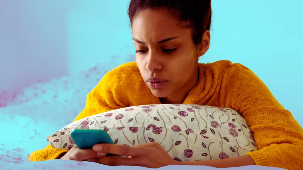 worried woman looking at phone