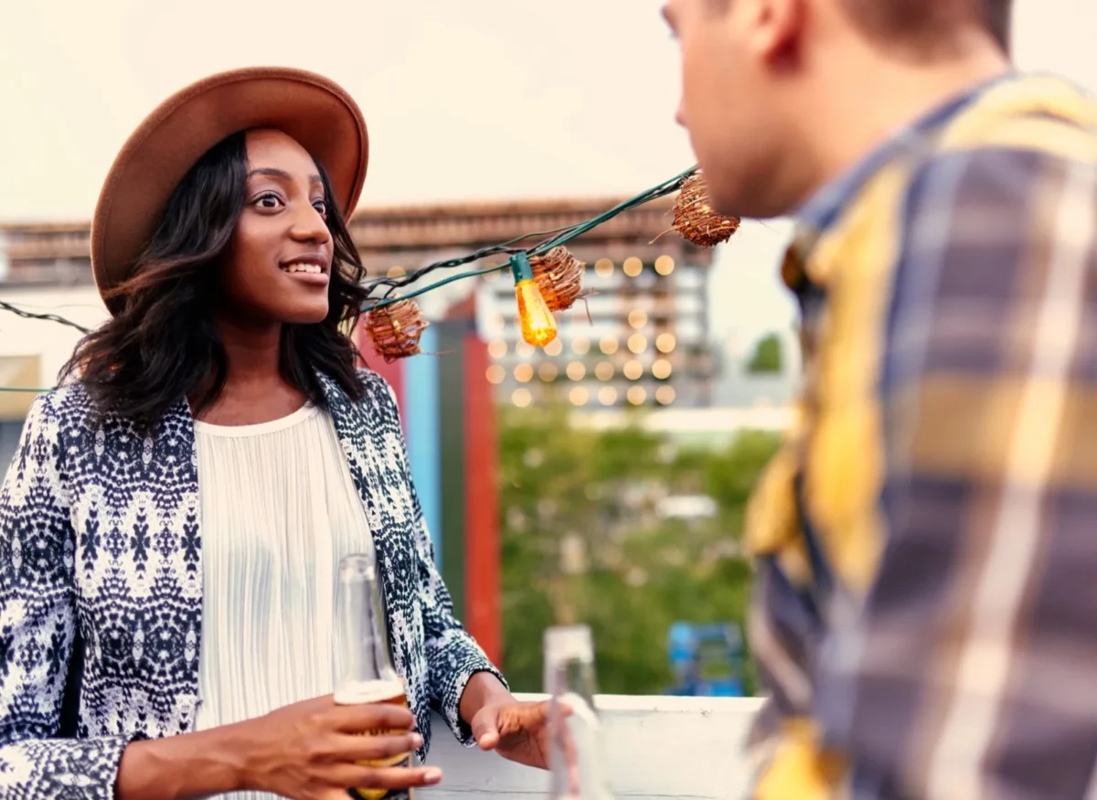 How To Get Back Together With An Introvert woman talking to man on terrace