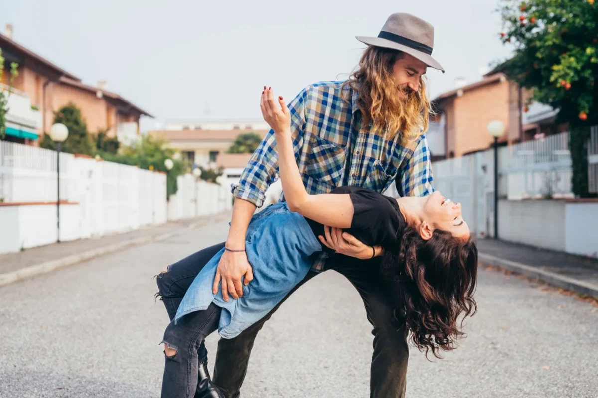 couple dancing outside in street
