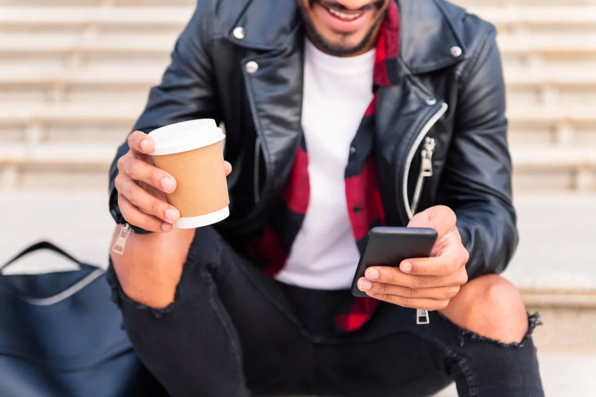 “Will He Come Back?” 4 Hopeful Signs Your Ex Boyfriend Will Get In Touch man holding phone