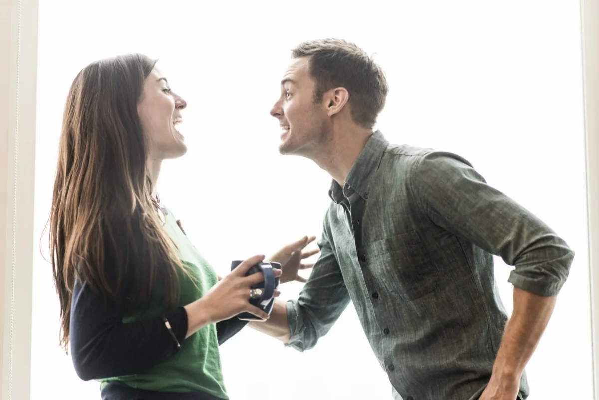 woman playfully challenging man
