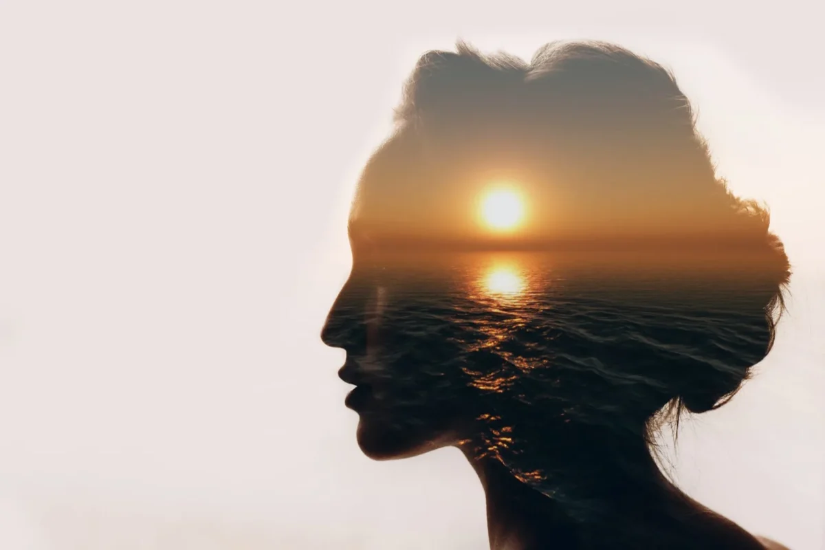 “Will He Come Back?” 4 Hopeful Signs Your Ex Boyfriend Will Get In Touch woman's portrait with sunrise overlaid