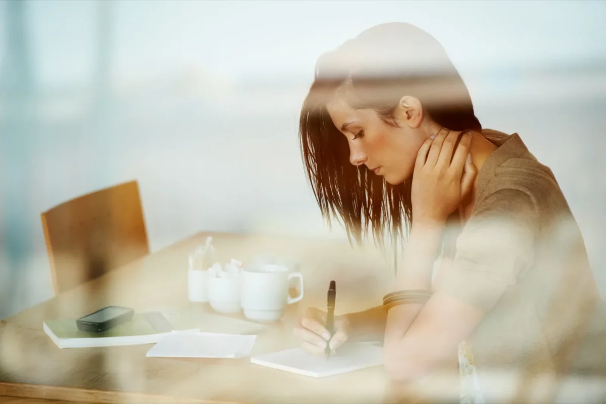 woman writing a list