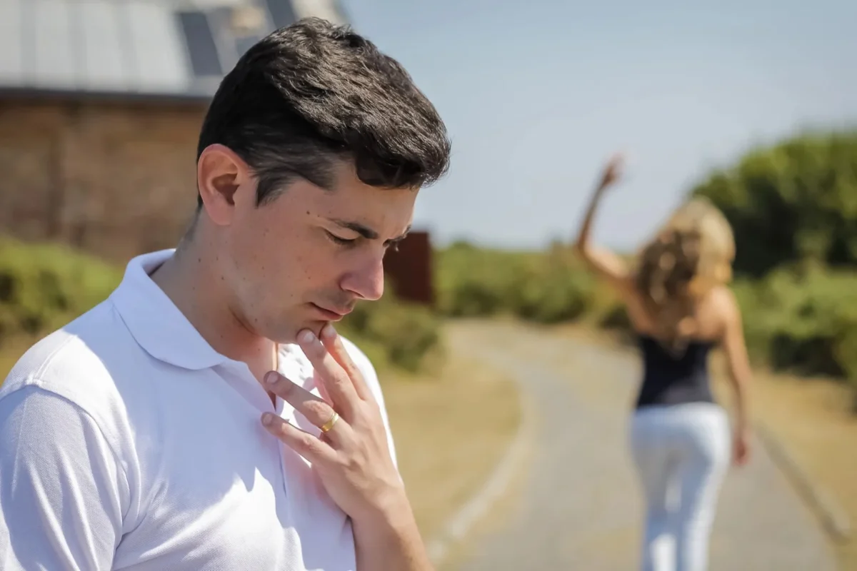 woman walking away from man leaving him alone