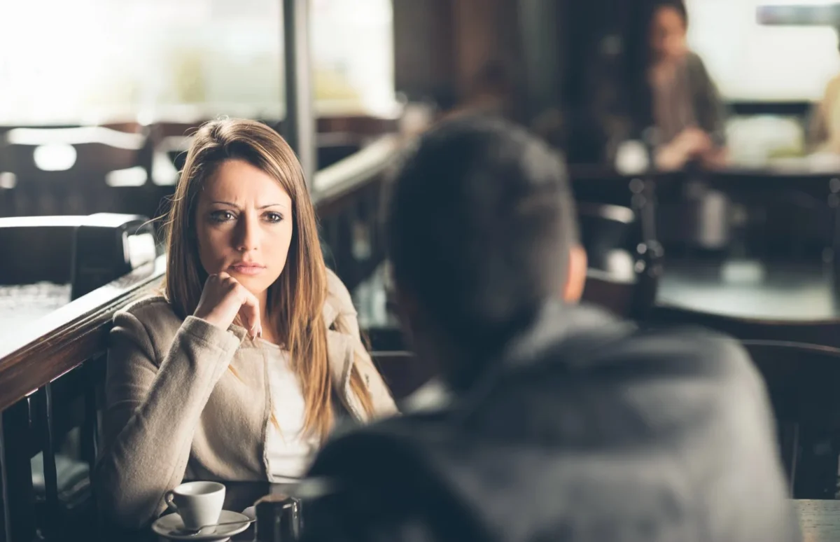 woman listening to man explaining