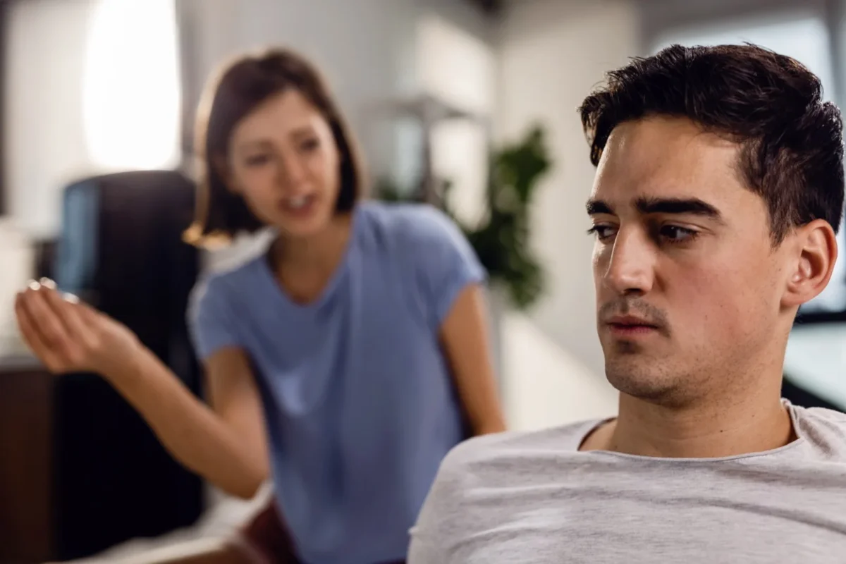 unhappy man with woman confronting him