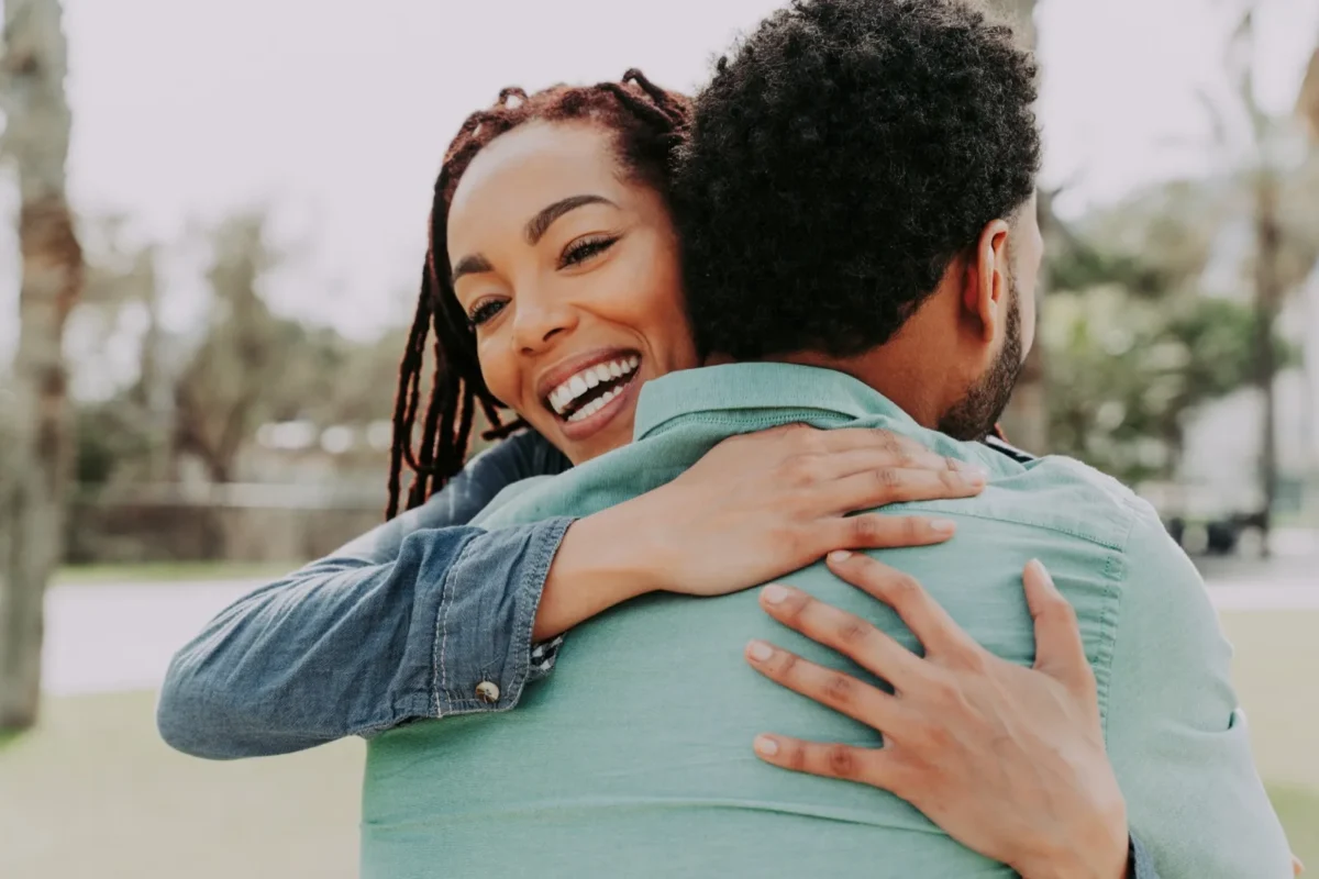 13 Crucial Ways To Show Your Husband You Appreciate Him woman hugging man