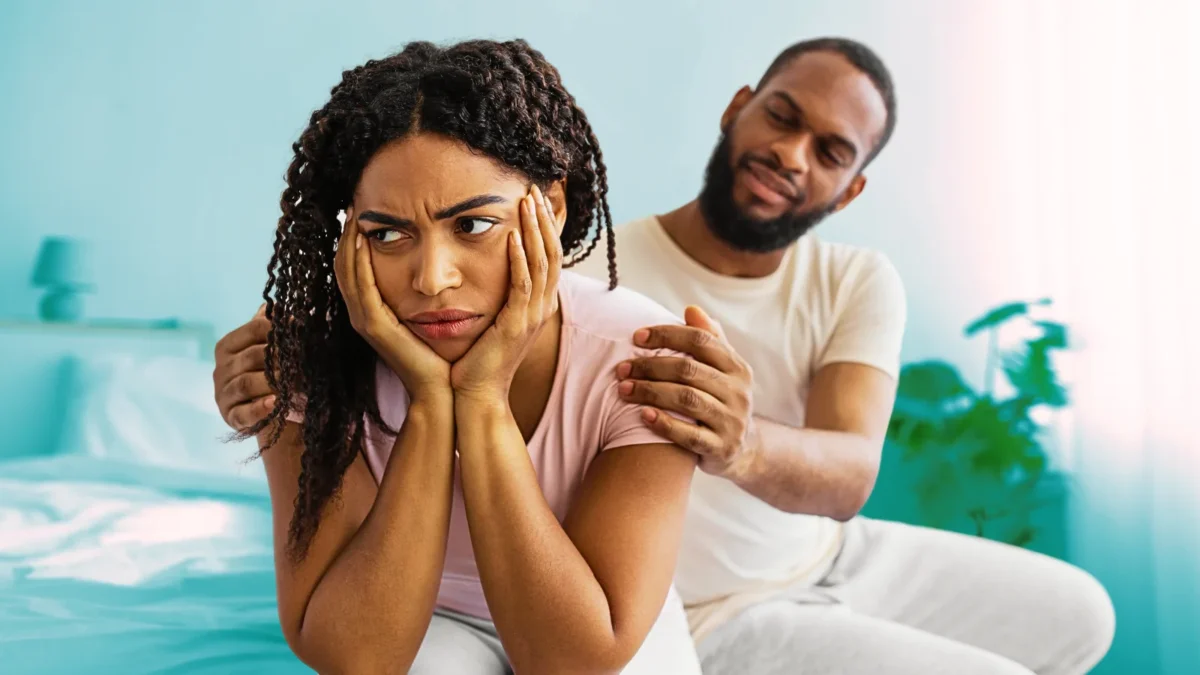 upset woman with man trying to comfort her