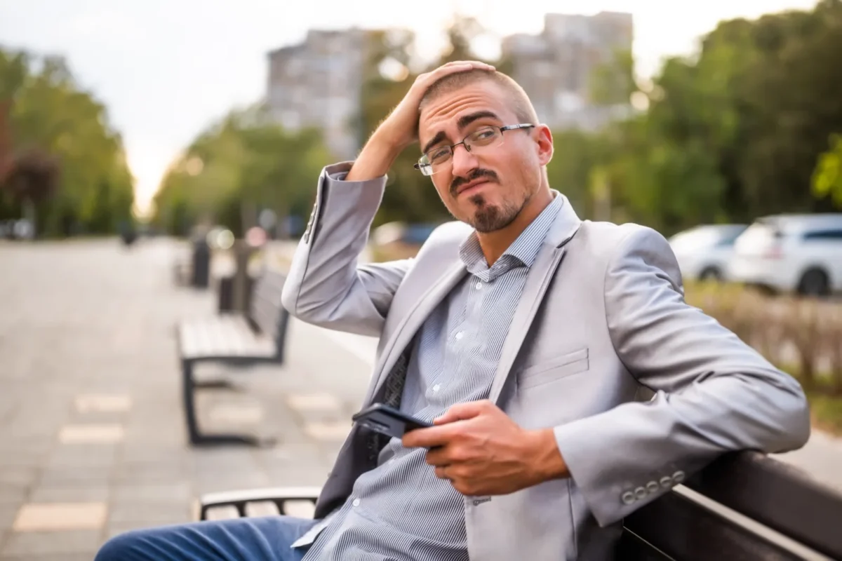 confused man with phone