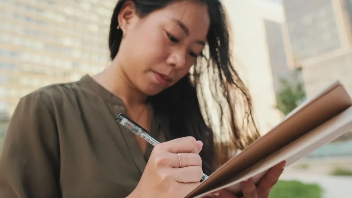 woman writing in journal