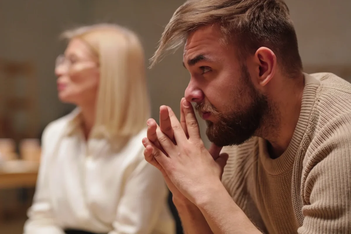 man listening to woman