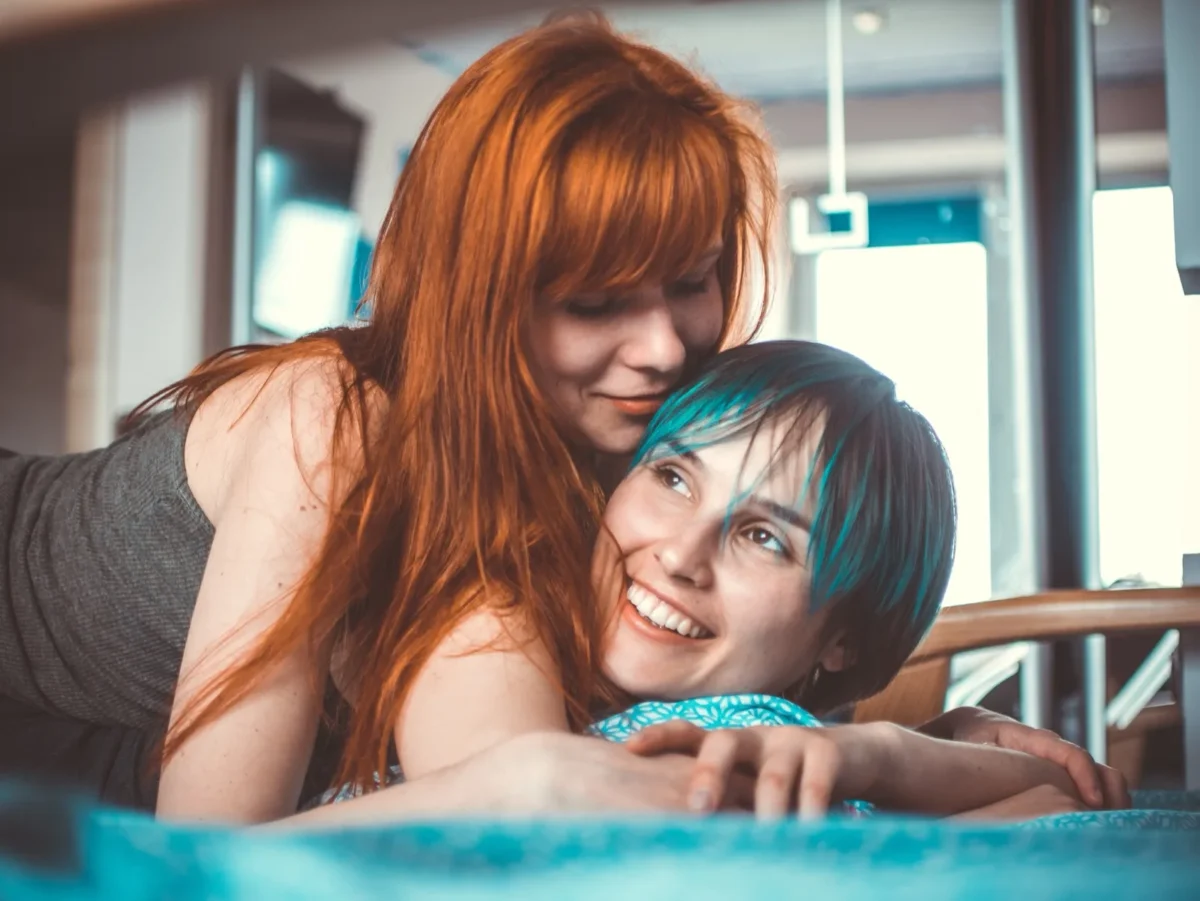 affectionate women cuddling