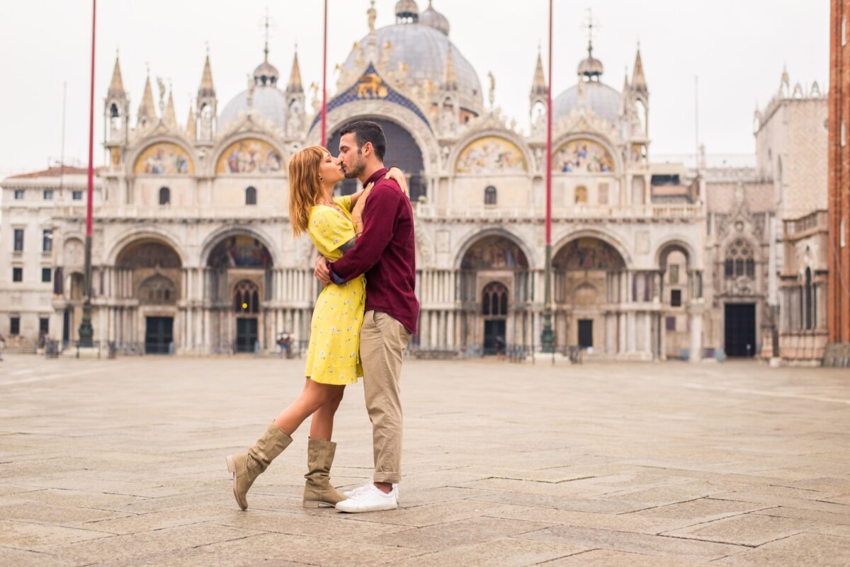 How Technology Is Quietly Draining the Intimacy From Your Relationship couple kissing in venice