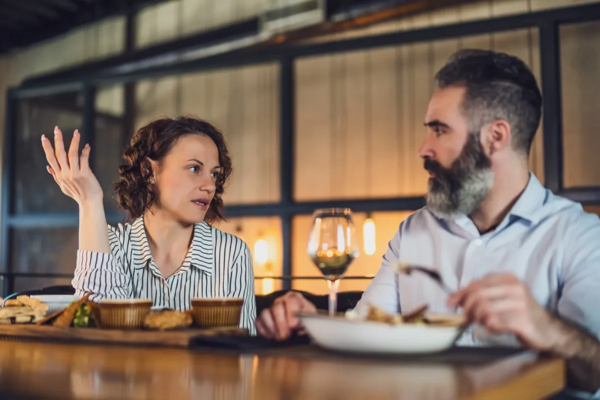 couple having discussion at dinner