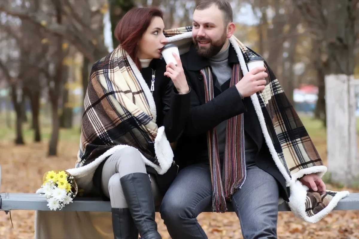 cute couple sitting on bench