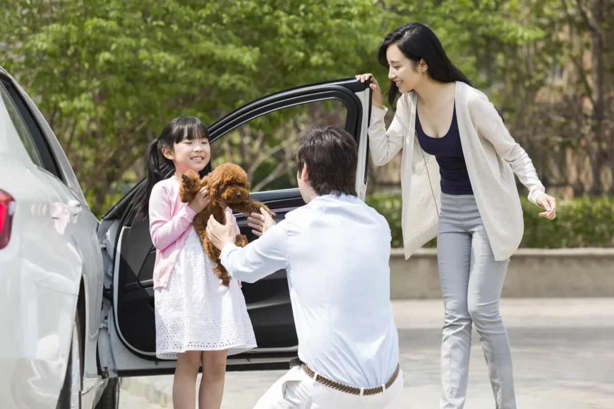 family doing divorce drop off with little girl