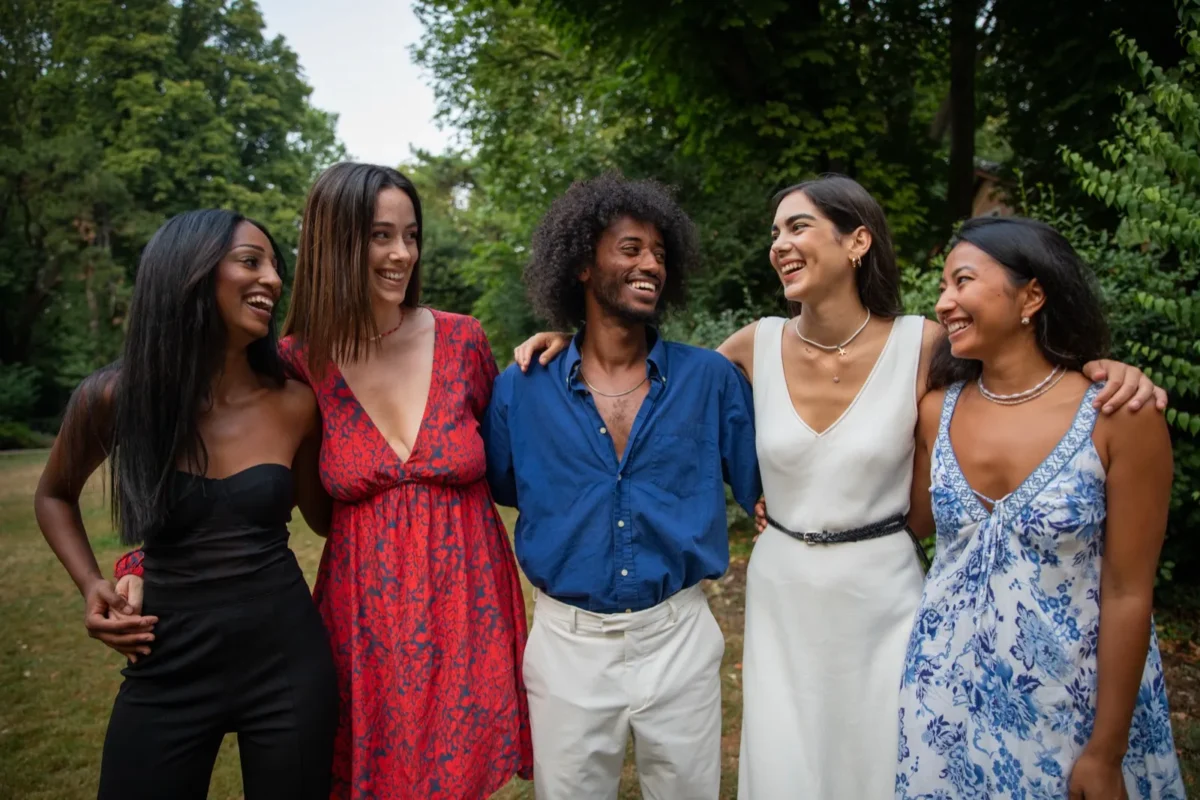 group of friends smiling outside