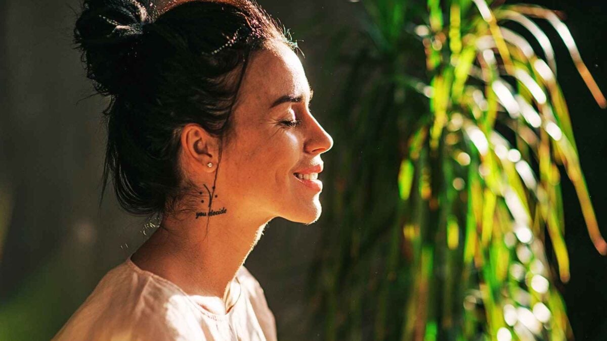 woman smiling with eyes closed