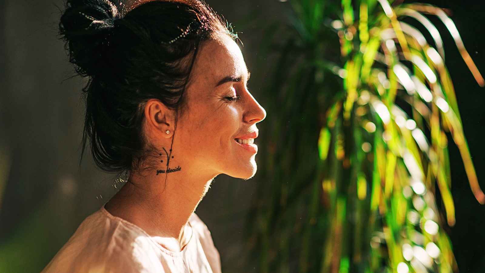 woman smiling with eyes closed