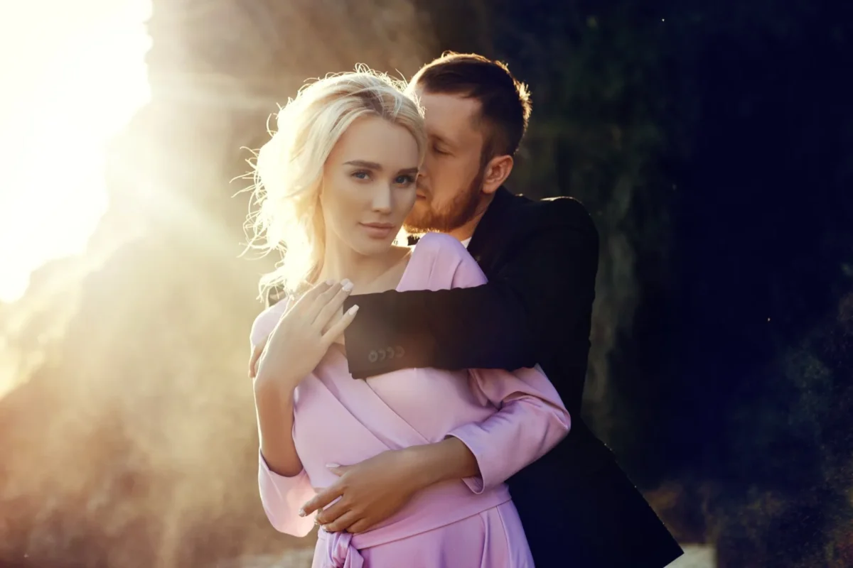 You Can Enjoy Being Objectified. It'll Still Wreck Your Relationship. man embracing woman from behind possessively