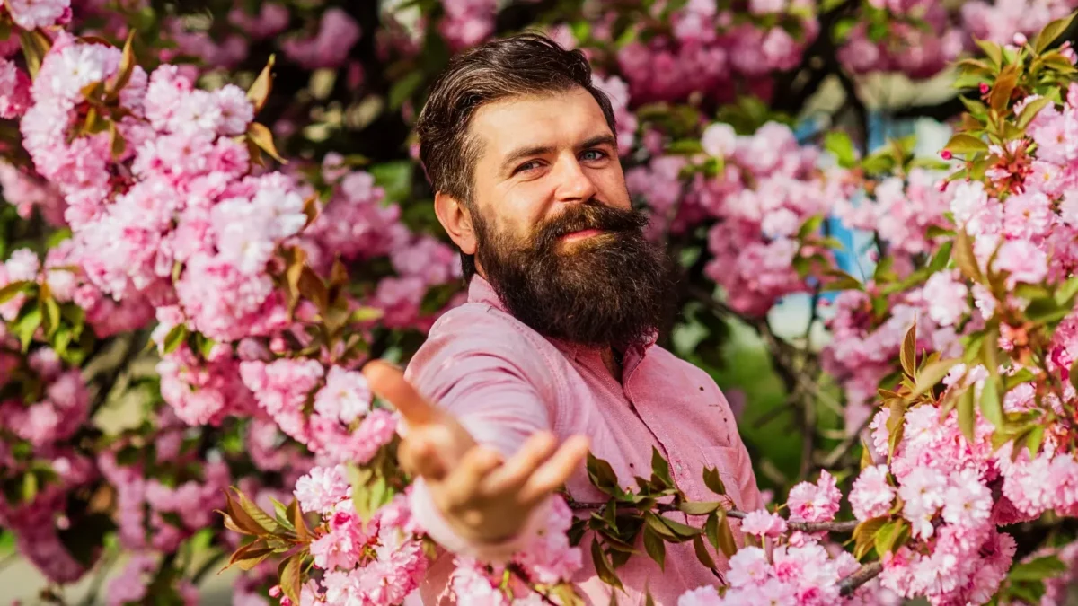 man with pink flowers