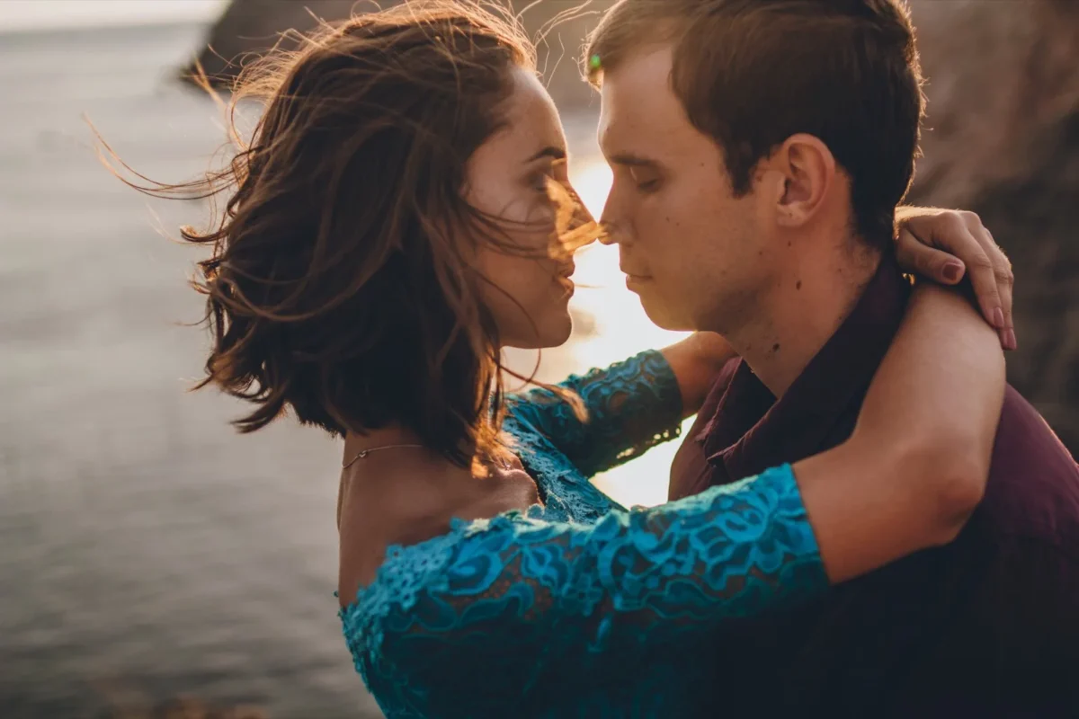 romantic couple embracing at sunset