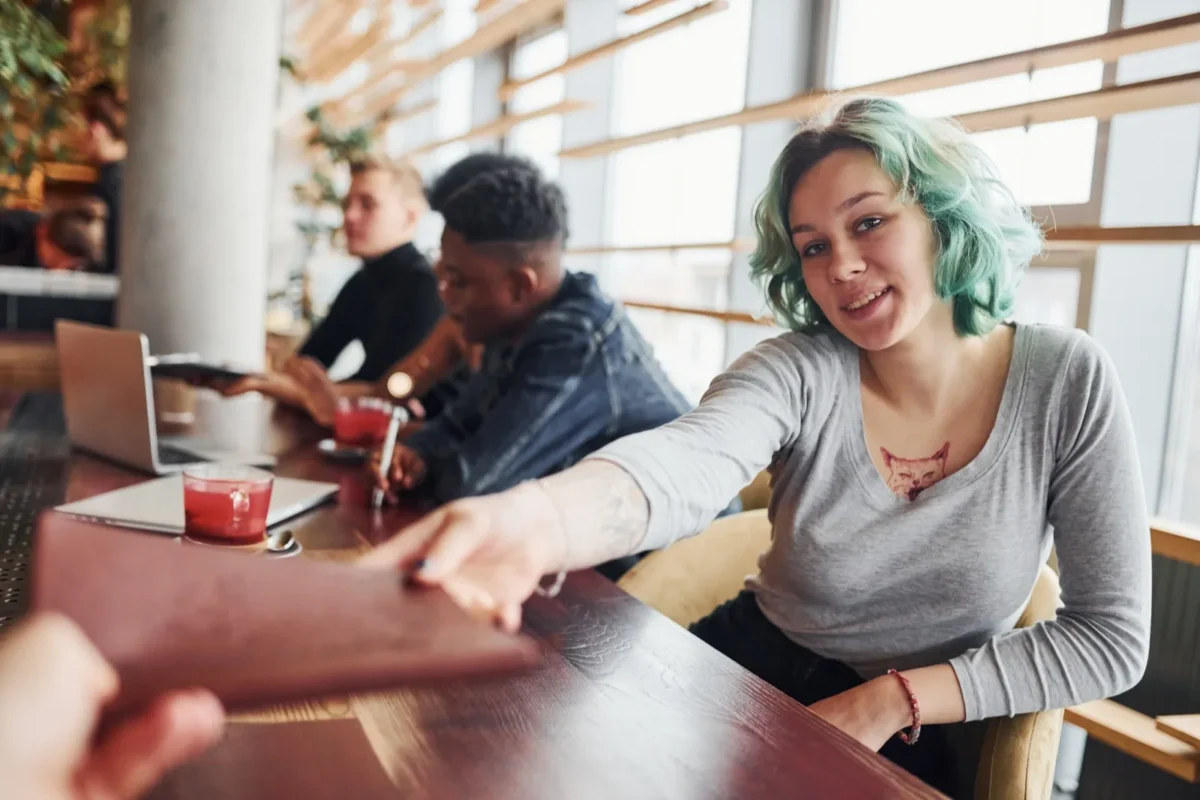 woman shaking person's hand