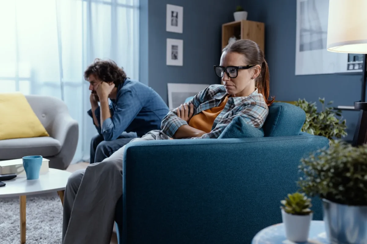 upset couple in living room