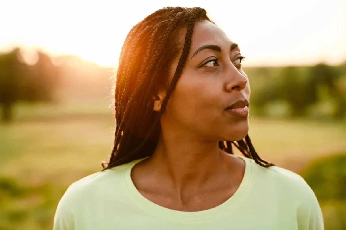 woman at sunset in field