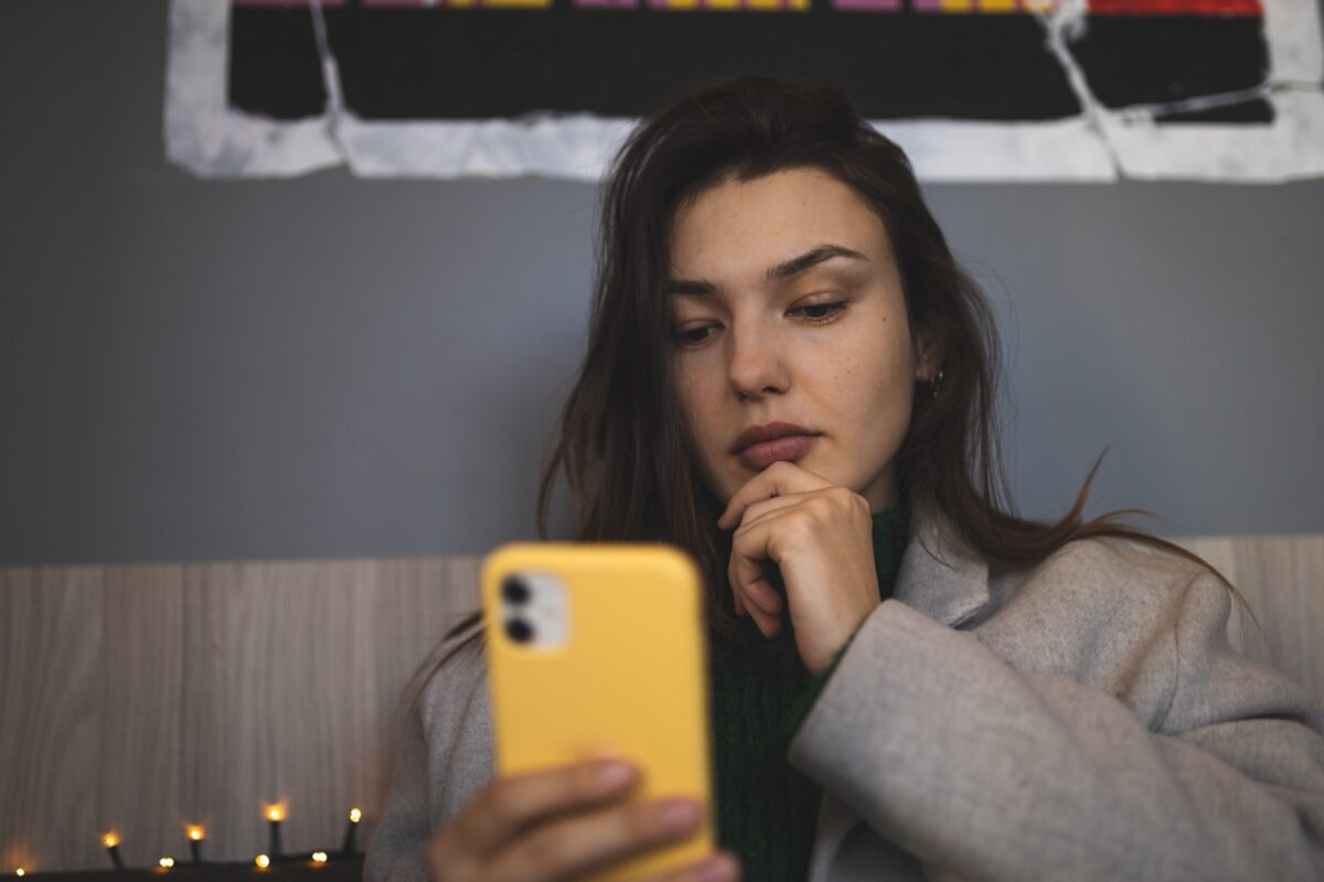 woman holding phone