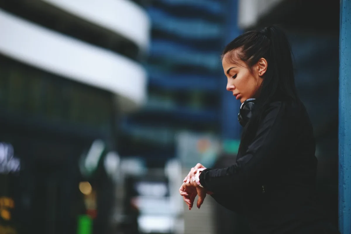 woman looking at watch