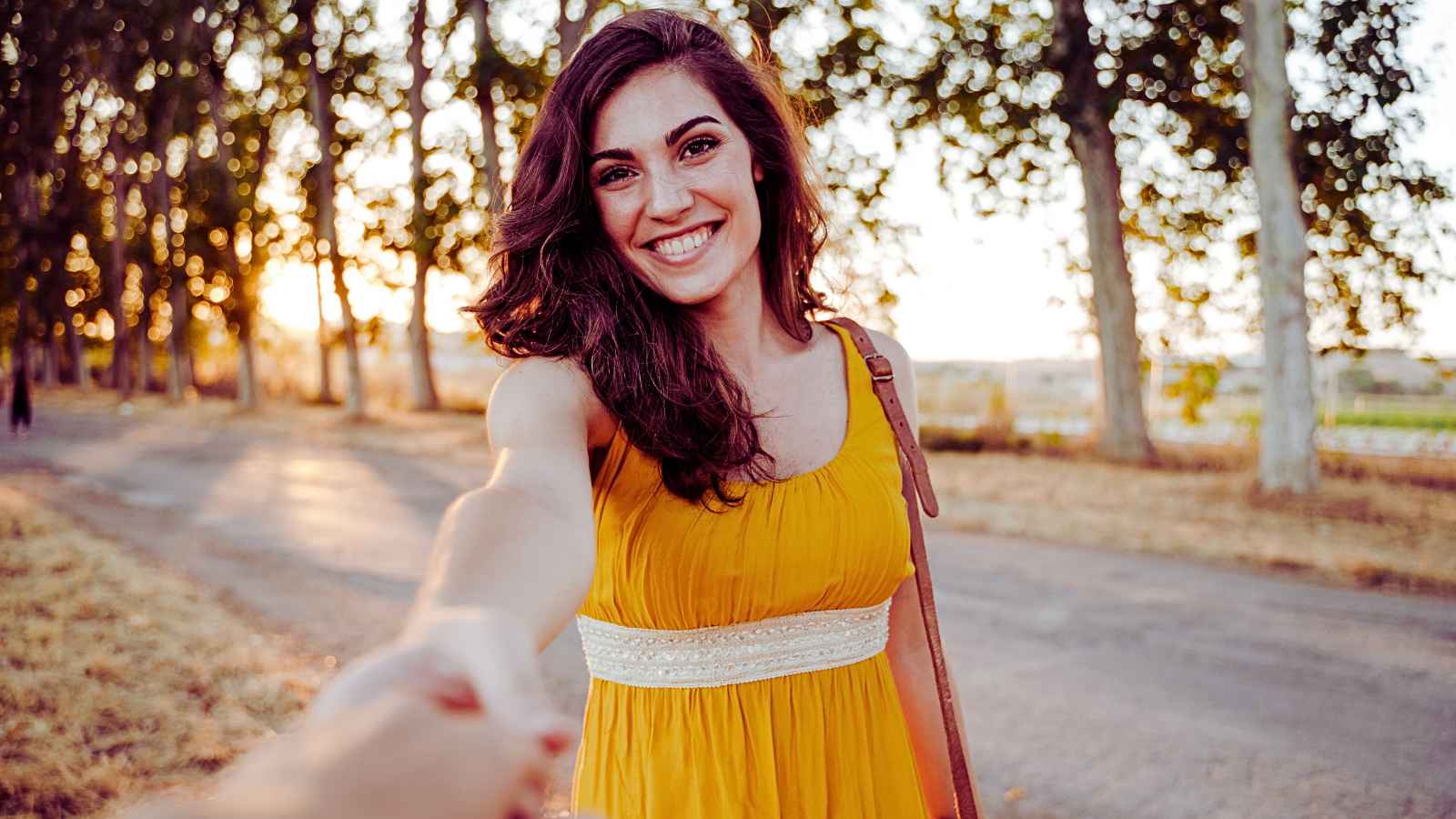 woman smiling in yellow