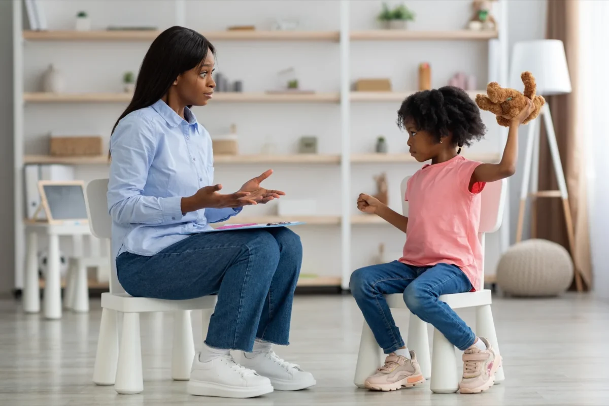 young girl with therapist