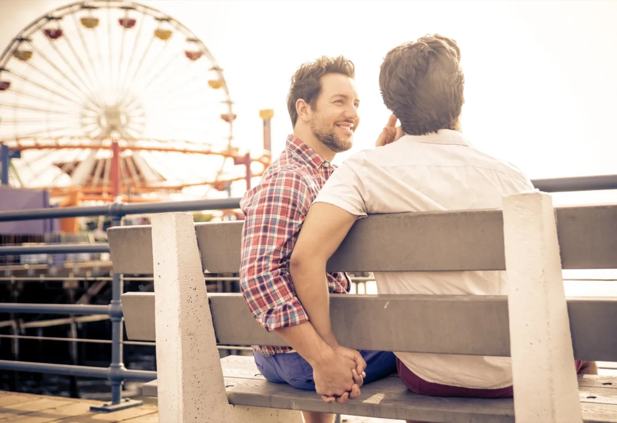 couple holding hands on beach