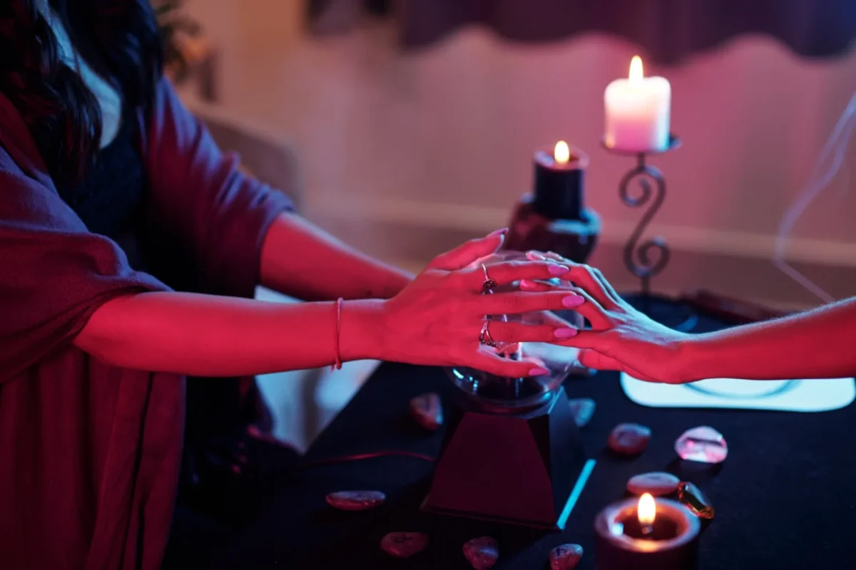 The Real Reason People Refuse to Give Up on the Soulmate Myth hands on crystal ball