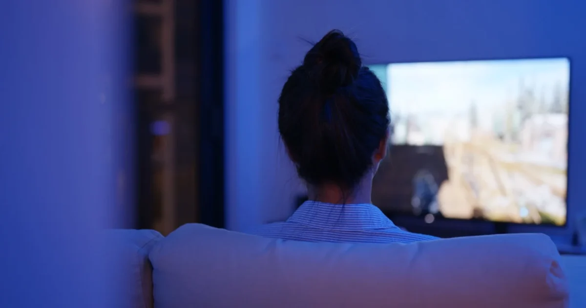 person watching tv alone