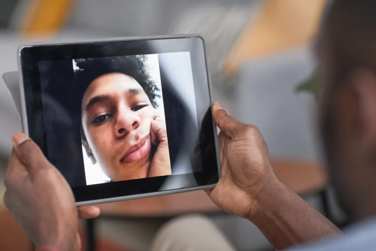sad man on tablet