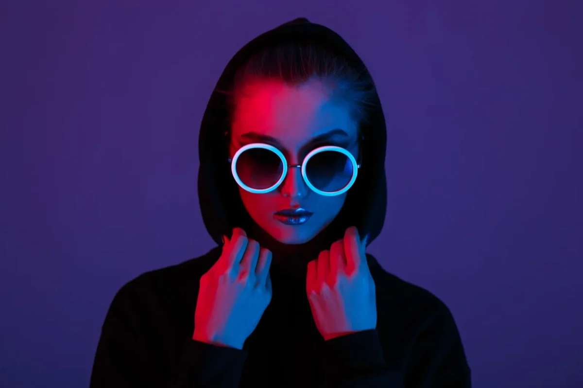 woman in hoodie wearing dark glasses